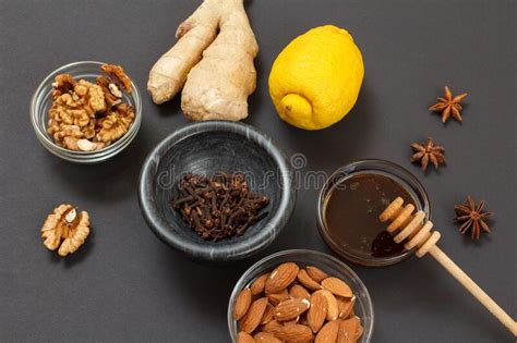 Health Remedy Foods For Cold And Flu Relief On A Black Background Stock