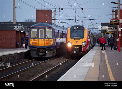 Virgin Trains Diesel Voyager Train And Northern Rail Class 319 Electric Train At Wigan North