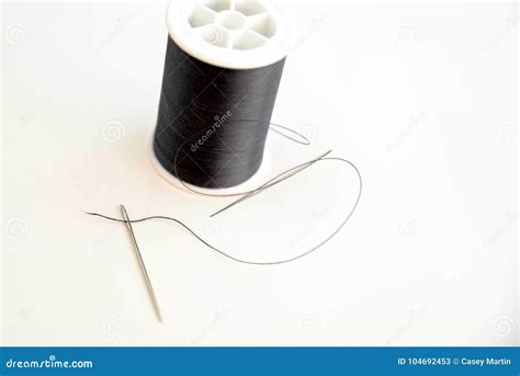 Threaded Needle And Black Spool Of Thread Stock Image Image Of Black