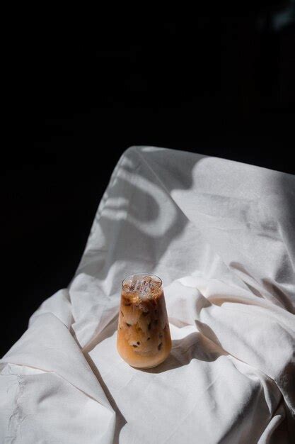 Premium Photo Close Up Glass Of Iced Coffee With Milk On The Table