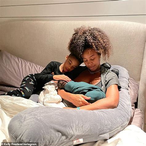 Kelly Rowland shares a precious snap holding her newborn son Noah... 21 days after giving birth ...