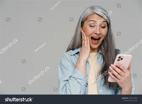 Mature Excited Woman Screaming Using Mobile Stock Photo 1955757403 Shutterstock