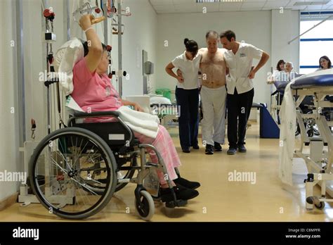 Patients doing physical rehabilitation exercises at hospital's ...