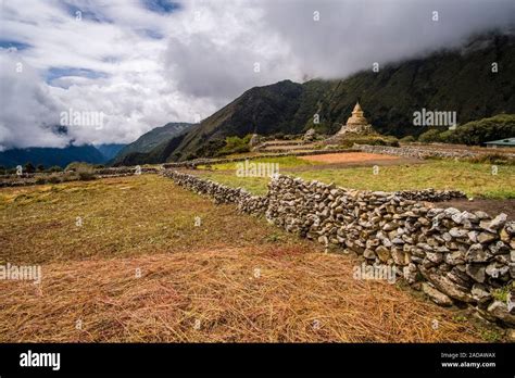 Harvested Fields Surrounded By Stone Walls A Big Old Stupa Monsoon