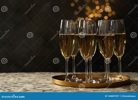 Tray With Glasses Of Champagne On Table Against Blurred Lights Stock Image Image Of Business