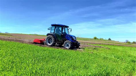 Farmer Cultivating Make Soil Tillage Before Seeding Plants In The