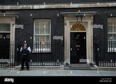 Number Ten Downing Street The Home Of The British Prime Minister With A Security Guard Posted