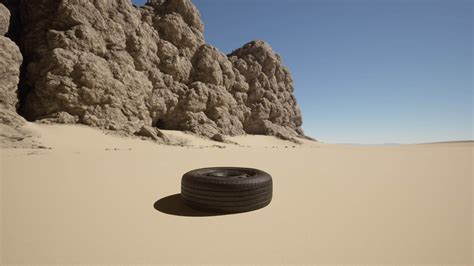 Uma Pneu Deitado Em A Areia Dentro Frente Do Alguns Pedras