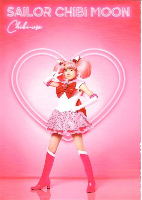 Sailor Chibi Moon Is Standing In Front Of A Pink Background With The