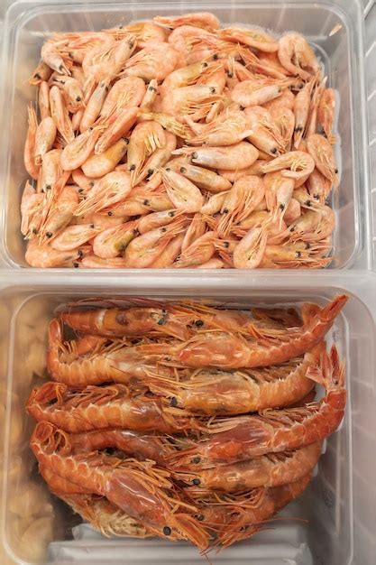 Premium Photo Frozen Raw Langoustines And Prawns In A Plastic