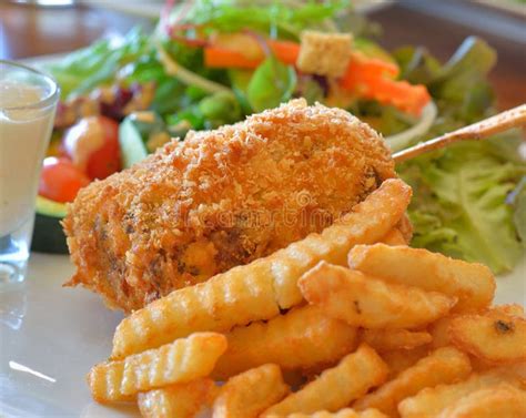 Fried Chicken Stuffed with Cheese on White Plate Stock Photo - Image of ...