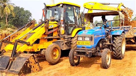 Jcb Dx Backhoe Loader Machine Loading Mud In Mahindra Di