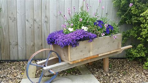 We Made This Rustic Wooden Wheelbarrow Planter From A Second Hand Wheel And Some Wood