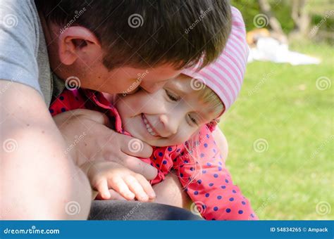 Father Hugging Young Daughter Outdoors Stock Image Image Of Intimate