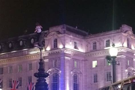 Piccadilly Circus Locked Down After Man Climbs 11 Metre High Statue Of