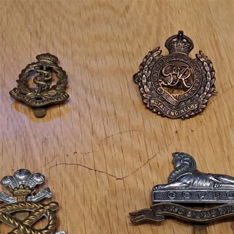 British Military Regimental Cap Badges And Napoleonic Medallion £8500