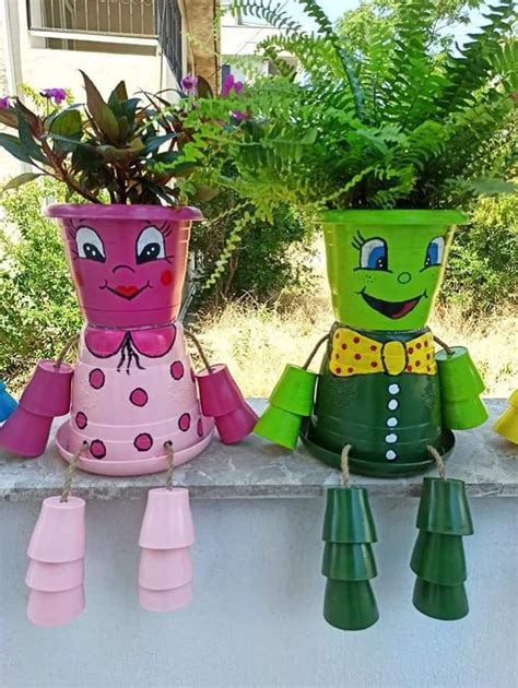 Three Pots With Plants In Them Sitting On A Ledge