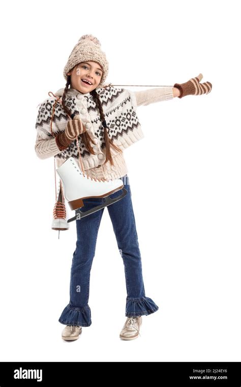 Funny little girl with ice skates on white background Stock Photo - Alamy