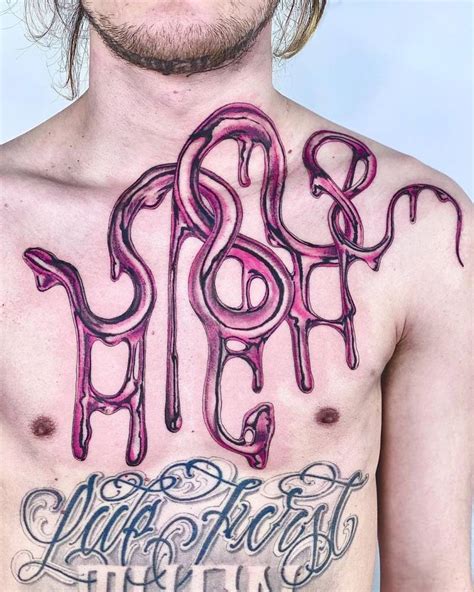 Metallic effect "HIGH" lettering tattoo on the chest.