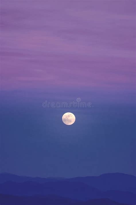 A Full Moon in a Purple Sky Stock Photo - Image of purplehued, distant ...