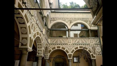 The Inside Of An Old Building With Arches And Windows