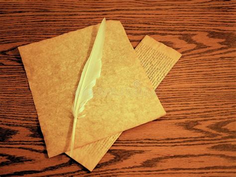 Parchment and Feather Quill for Writing on Wooden Desk Stock Image ...