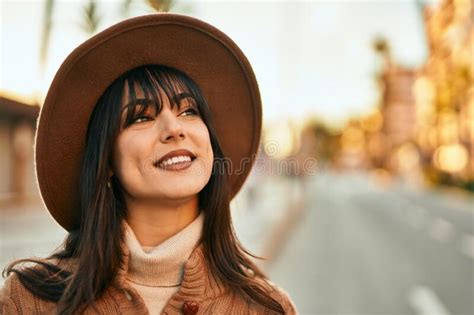 Brunette Woman Wearing Winter Hat Smiling Outdoors At The City On Sunset Stock Photo Image Of