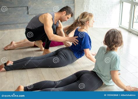 Group of People with Trainer Doing Yoga Pose in Gym or Studio Stock Photo - Image of middle ...