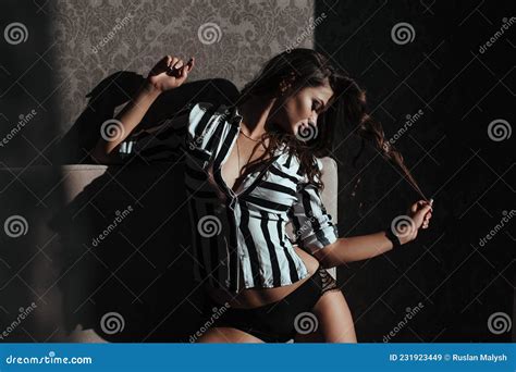 Brunette Woman Posing In Elegant Lingerie Looking At Camera Girl With