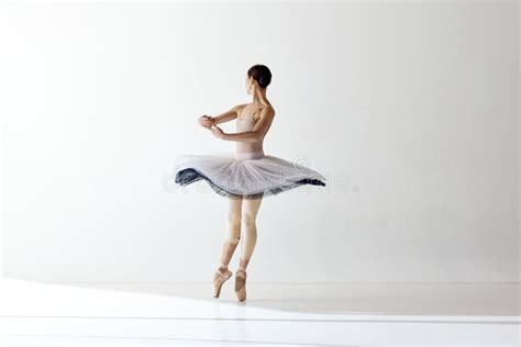 Graceful Movements Of One Beautiful Ballerina Dancing Isolated Over