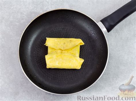 Рецепт: Яичные конвертики с сыром и ветчиной на RussianFood.com