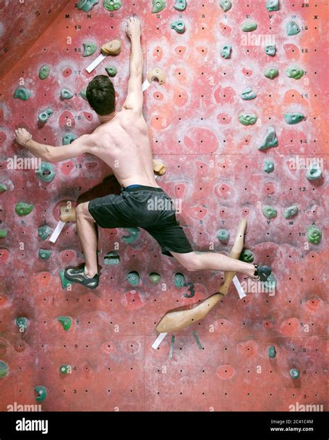 Man Bouldering At Indoor Gym In England Stock Photo Alamy