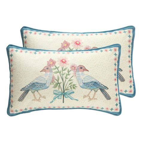 Two Pillows With Birds On Them And Flowers In The Middle One Has Blue Trim