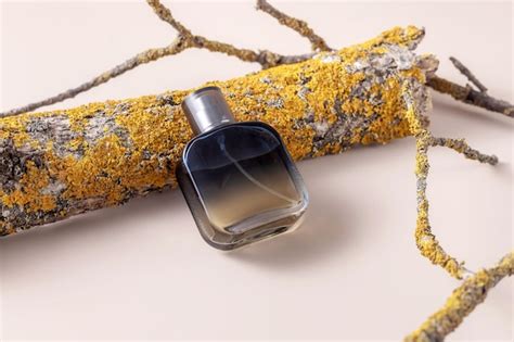 Premium Photo Perfume In A Spray Bottle Bark And Branches Of A Tree