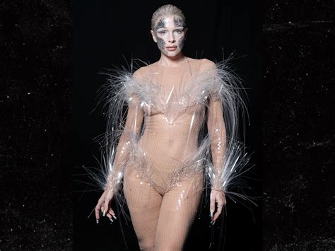 Julia Fox Wears Racy Nude Colored Jumpsuit With Feathers Face Paint