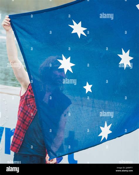 A Participant Holds An Australian Flag During Australia Day Ute Run In
