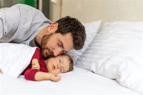 Handsome Brunette Father Kissing Sleeping Infant Baby Tenderly Stock Image Image Of Cute