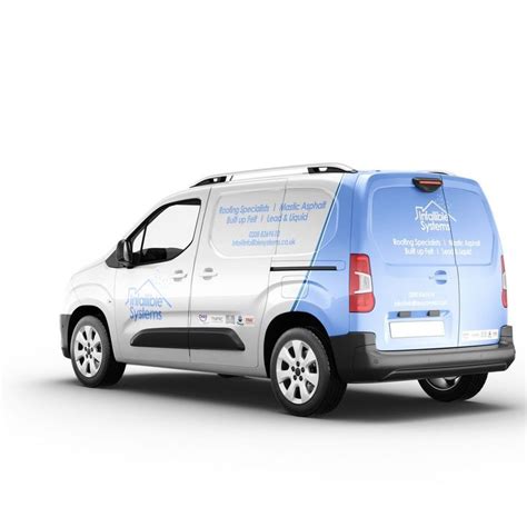 A Blue And White Van Parked On Top Of A White Floor