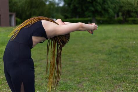 Premium Photo Woman Yogi With Dreadlocks Practicing Standing