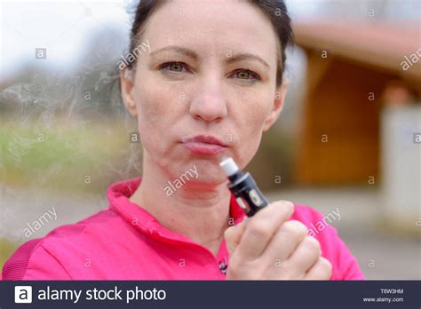 Woman Exhaling Smoke Stock Photos Woman Exhaling Smoke Stock Images