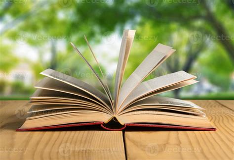 Book Open Book On Wood Planks Over Abstract Light Background 1374999