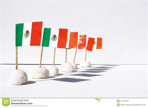 A Row Of Mini Mexican Flags With Shadows On A White Canvas Background