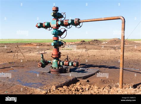 Oil Wellhead In The Oil Field Stock Photo Alamy