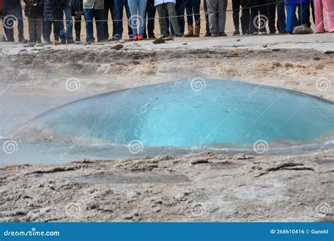 Strokkur Geyser Just Before Erupting And Many Tourists Waiting