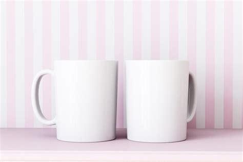 Premium Photo Two White Coffee Mugs Are On A Pink Table With A Pink