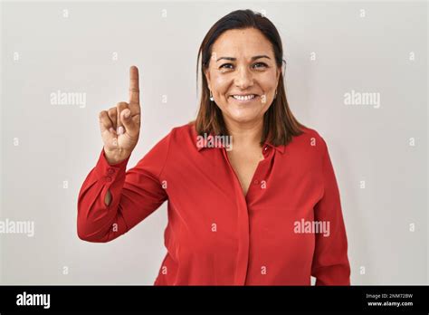 Hispanic Mature Woman Standing Over White Background Showing And