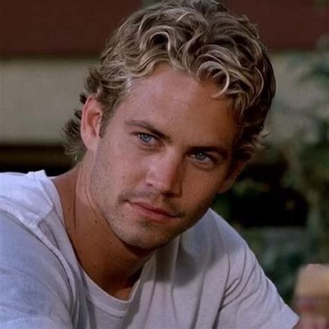 A Close Up Of A Person Wearing A White T Shirt And Looking At The Camera