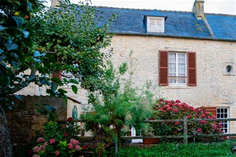 Quaint French Village In Scenic Normandy Showcasing Historic Charm And