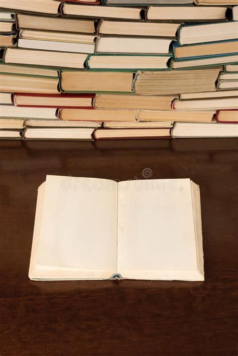 Open Blank Book On The Desk With Background Of Books Open Blank Book