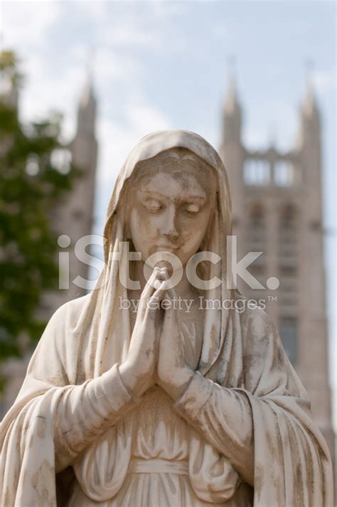 Praying Mary Statue IN Front of AN Old Church Stock Photos - FreeImages.com